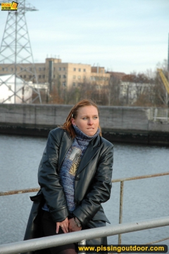 Pissing on the bridge over river - N