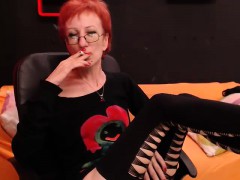 hot-redhead-lady-with-glasses-enjoys-a-cigarette-and-loses