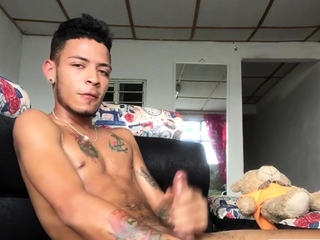 Inked Latin twink strokes his pecker